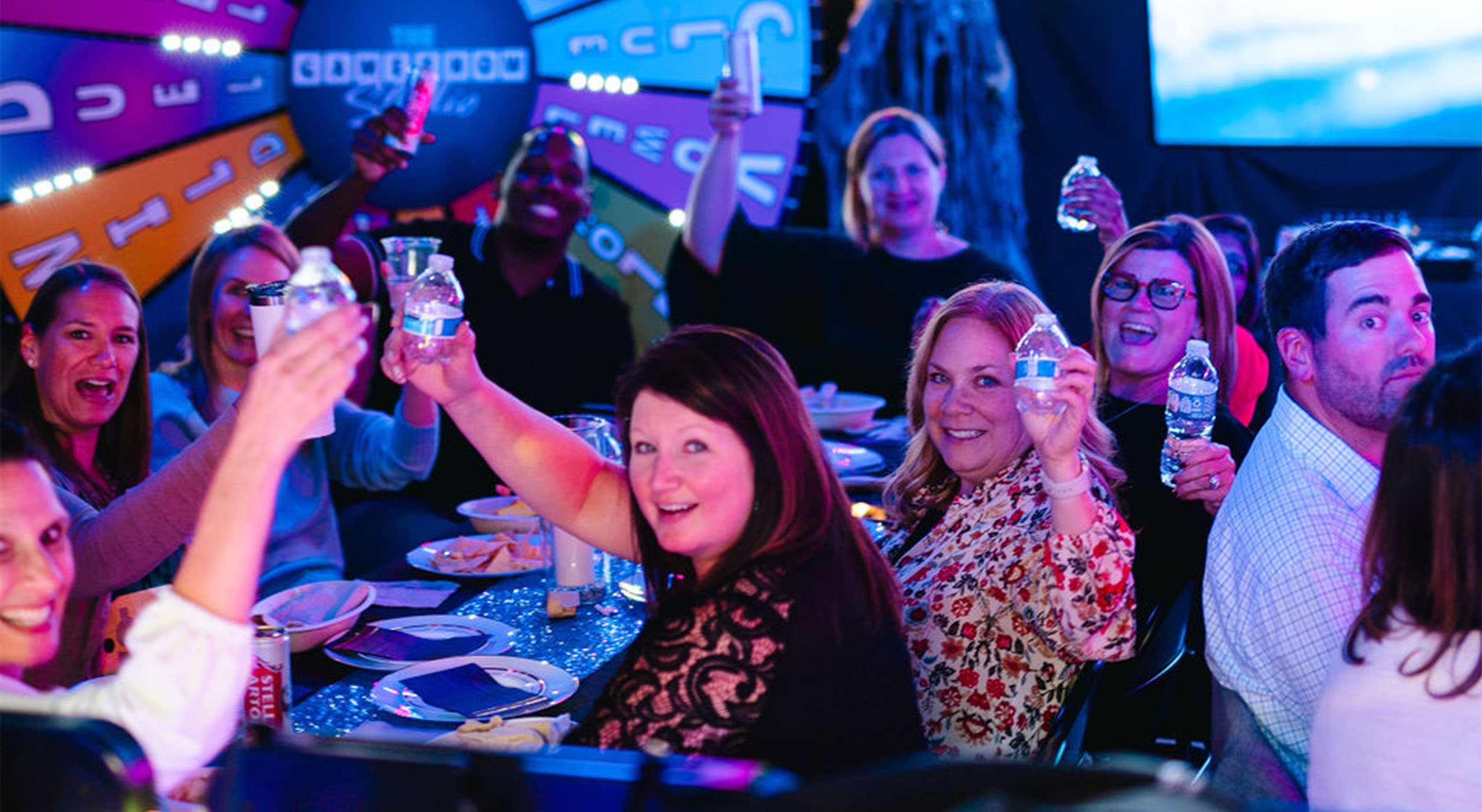 Energetic group of people enjoying a trivia game show event